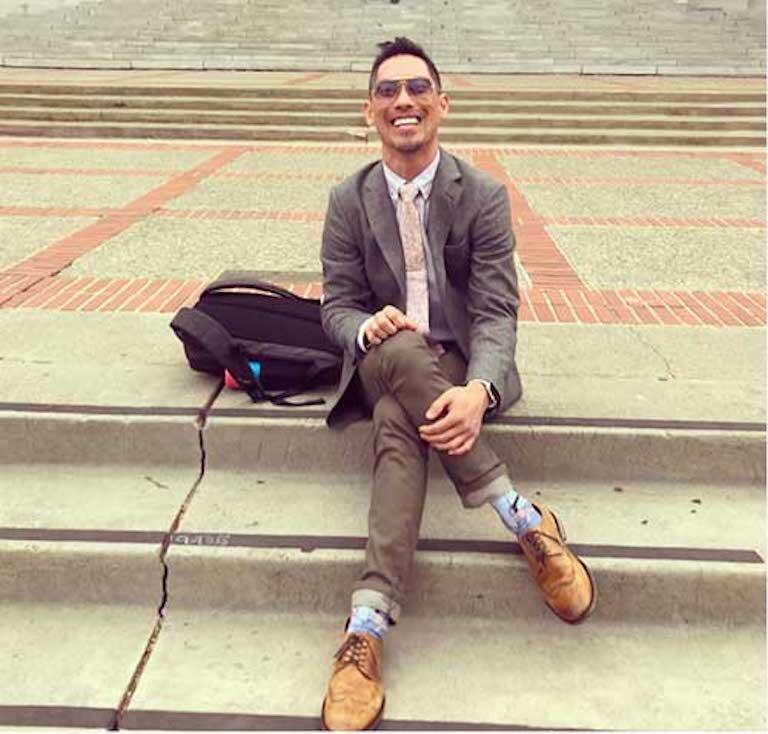 Instructor Richie Kim sitting on Berkeley campus steps